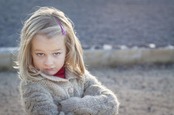 Little girl looks at camera with an I told you so"attitude. 