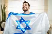 Happy man holds flag of Israel. Pic: Shutterstock