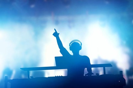 DJ at mixing deck. Photo by Shutterstock