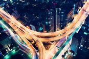 Road at night image via Shutterstock