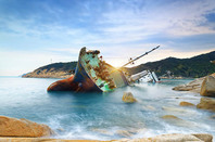wrecked cargo ship abandoned on sea bay. pHOTO BY shUTTERSTOCK