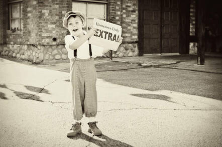 A child selling newspapers