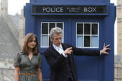 peter capaldi as the Doctor and jenna coleman as the assistant in front of the Tardis - from bbc kids fantasy series Doctor Who