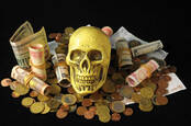 A skull atop money