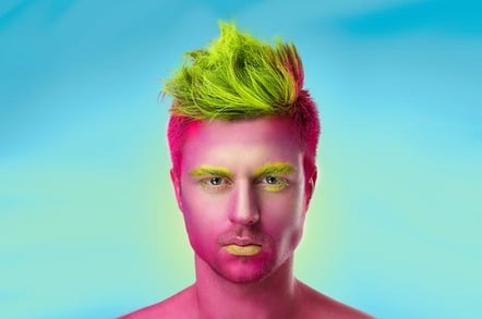 Handsome man has fuchsia-painted skin. Photo by Shutterstock