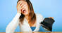 An upset woman with an empty wallet