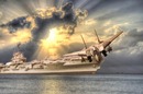 aircraft takes off from carrier, enters clouds. Photo by shutterstock