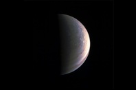 NASA's Juno spacecraft captured this view as it closed in on Jupiter's north pole, about two hours before closest approach on Aug. 27, 2016. Credits: NASA/JPL-Caltech/SwRI/MSSS
