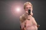 John McAfee with gun