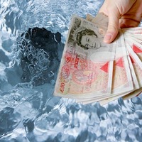 Sheaf of £50 notes poised on the rim of a toilet bowl as toilet is flushed. Collage of two photos sourced from Shutterstock