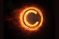 Burning copyright symbol. Photo by SHUTTERSTOCK 