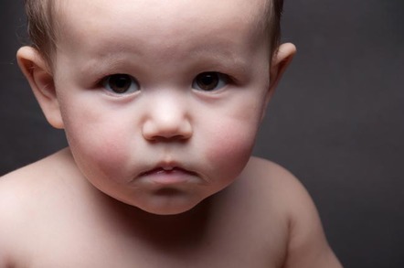 Sad, disappointed-looking baby. Photo by Shutterstock