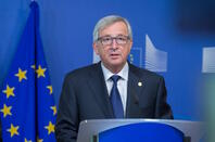 Jean-Claude Juncker speaking in front of EU flag