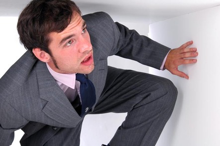 man in suit is trapped in a box, Photo by Shutterstock