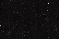 Galaxies stretching back into time across billions of light-years of space. The image covers a portion of a large galaxy census called the Great Observatories Origins Deep Survey (GOODS).