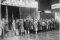 Unemployed men queued outside a depression soup kitchen opened in Chicago by Al Capone U.S. Information Agency. (08/01/1953 - 03/27/1978)