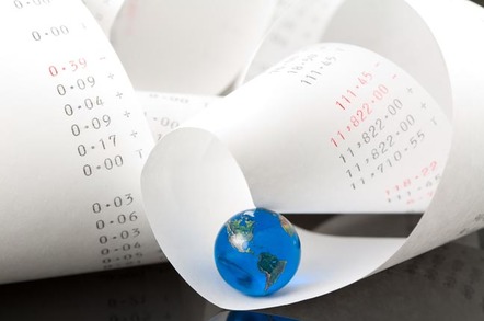 roll of figures on adding machine ledger with a world map globe nestling in the folds...Photo by Shutterstock