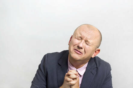 A businessman begging