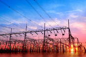 High voltage power grid, in the sunset. Photo by SHutterstock