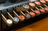 Old cash register photo via Shutterstock