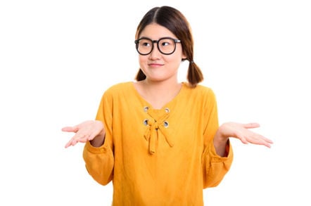Woman shrugs. Photo by sHutterstock