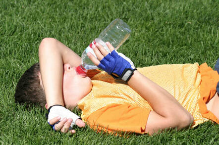 Tired football kid. Photo by Matt Ragen/Shutterstock