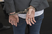 Handcuffs photo via Shutterstock