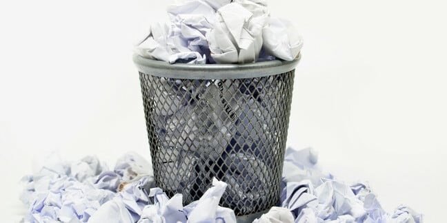 Wire wastepaper bin filled with scrunched up paper. Photo by Shutterstock