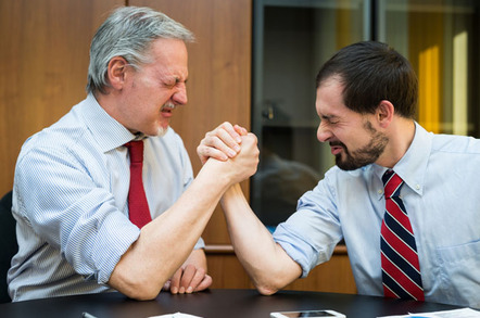 Arm wrestling photo via Shutterstock