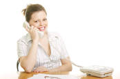 Woman smiling on phone/. photo by shutterstock
