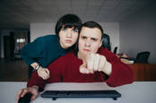 people peer into camera. photo by shutterstock