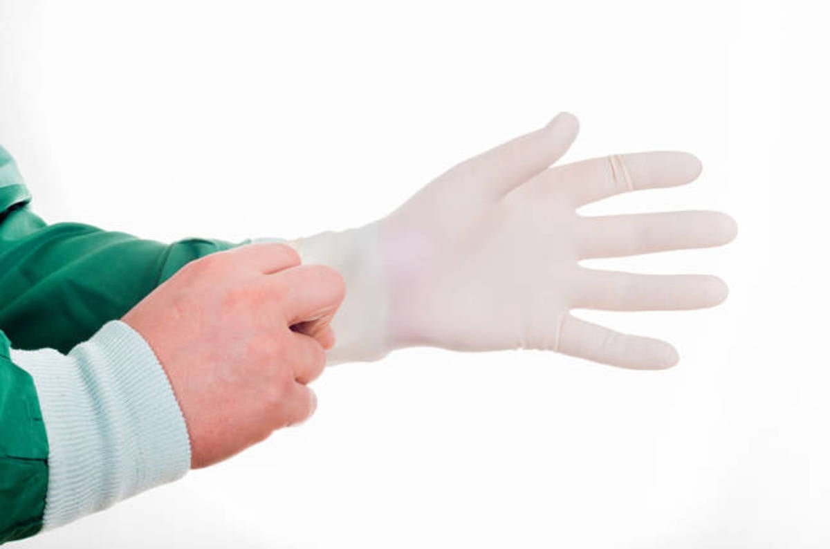 photo of FCA straps on rubber gloves, eyes Redcentric's accounting mess image