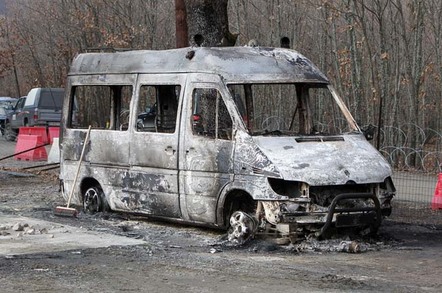 Burned out van photo via Shutterstock