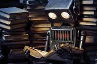 Young robot studying photo via Shutterstock