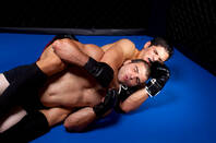 Cage fighter in a choke hold