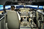 Aurora Flight Sciences' ALIAS robot in a simulated 737 cockpit