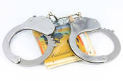 Australian $50 bills with handcuffs