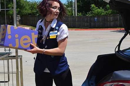 A Walmart worker delivering a package for the company