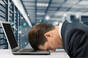 stressed exec in server room. pic shutterstock
