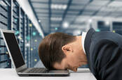 stressed exec in server room. pic shutterstock