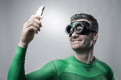 Superhero on a mobile phone. pic by shutterstock