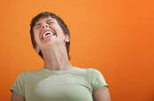 woman laughs in a freaked-out way. Pic by shutterstock