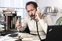 Upset man at desk shouts into phone. Pic: Shutterstock