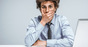 Surprised man computer photo via Shutterstock
