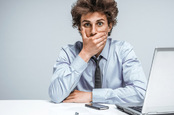 Surprised man computer photo via Shutterstock