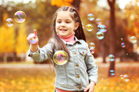 Girls with bubbles photo via Shutterstock