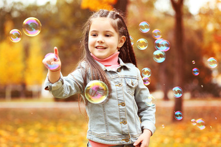 Girls with bubbles photo via Shutterstock