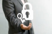 Businessman with unlocked padlock - shutterstck