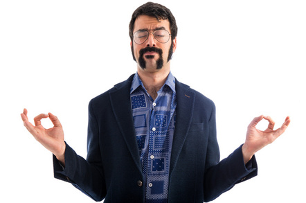 Nerd meditating photo via Shutterstock