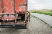 Broken container photo via Shutterstock